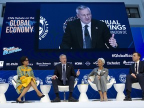 French Economy Minister Bruno Le Maire speaks during an Global Economy debate accompanied from left, Indonesian Finance Minister Sri Mulyani Indrawati, International Monetary Fund (IMF) Managing Director Christine Lagarde, and Canada's Financial Minister William Morneau, in the sidelines of the World Bank/IMF Annual Meetings in Washington, Thursday, Oct. 12, 2017. ( AP Photo/Jose Luis Magana)
