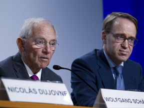 Germany Finance Minister Wolfgang Schäuble accompanied by Germany Bundesbank President Jens Weidmann, speaks during a news conference, after the G20 finance ministers and central bank governors meeting, on the sidelines of the World Bank/IMF Annual Meetings in Washington, Friday, Oct. 13, 2017. ( AP Photo/Jose Luis Magana)