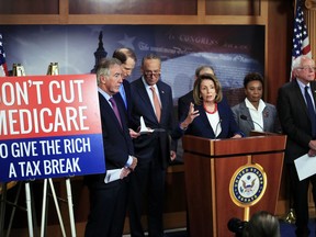 House Minority Leader Nancy Pelosi of Calif., front center, with Rep. Richard Neal, D-Mass., from left, Sen. Ron Wyden, D-Ore., Senate Minority Leader Chuck Schumer of New York, Rep. Barbara Lee, D-Calif., and Sen. Bernie Sanders, I-Vt., speaks during a news conference on Capitol Hill in Washington, Wednesday, Oct. 4, 2017, urging Republicans to abandon cuts to Medicare and Medicaid. (AP Photo/Manuel Balce Ceneta)