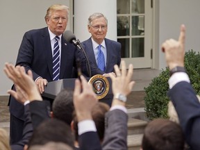 Journalist raise their hands as they wait to called on to ask a question to President Donald Trump and Senate Majority Leader Mitch McConnell of Ky., in the Rose Garden of the White House, Monday, Oct. 16, 2017. (AP Photo/Pablo Martinez Monsivais)