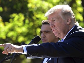 President Donald Trump, right, calls on a reporter during a news conference with Greek Prime Minister Alexis Tsipras, left, in the Rose Garden of the White House in Washington, Tuesday, Oct. 17, 2017. (AP Photo/Susan Walsh)