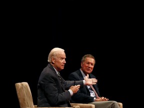 Former Vice President Joe Biden, left, and Ohio Gov. John Kasich participate in a discussion on bridging political and partisan divides at the University of Delaware in Newark, Del., Tuesday, Oct. 17, 2017. (AP Photo/Patrick Semansky)