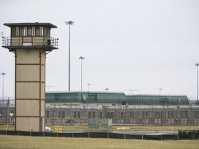 FILE - In this Feb. 1, 2017 file photo, the James T. Vaughn Correctional Center near Smyrna, Del., remains on lockdown following a riot. Delaware has charged 18 inmates in the deadly riot and hostage-taking at the state's maximum-security prison, most of them on murder charges, according to an indictment that was made public Tuesday, Oct. 17. The riot resulted in the murder of Lieutenant Steven Floyd, injuries to Correctional Officers Winslow Smith and Joshua Wilkinson, and the kidnapping of counselor Patricia May.  (Suchat Pederson /The Wilmington News-Journal via AP, File)