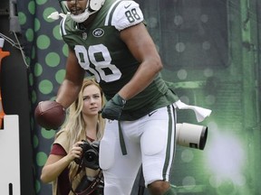 New York Jets tight end Austin Seferian-Jenkins (88) celebrates after catching a pass for a touchdown during the first half of an NFL football game against the New England Patriots, Sunday, Oct. 15, 2017, in East Rutherford, N.J. (AP Photo/Bill Kostroun)