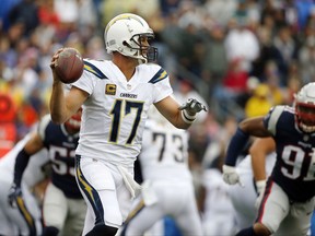 Los Angeles Chargers quarterback Philip Rivers drops back to pass during the first half of an NFL football game against the New England Patriots, Sunday, Oct. 29, 2017, in Foxborough, Mass. (AP Photo/Michael Dwyer)