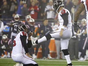 Atlanta Falcons kicker Matt Bryant, right, and holder Matt Bosher, left, react after Bryant missed a field goal during the second half of an NFL football game against the New England Patriots, Sunday, Oct. 22, 2017, in Foxborough, Mass. (AP Photo/Steven Senne)