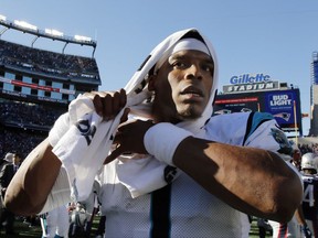 Carolina Panthers quarterback Cam Newton leaves the field after a 33-30 victory over the New England Patriots in an NFL football game, Sunday, Oct. 1, 2017, in Foxborough, Mass. (AP Photo/Bill Sikes)