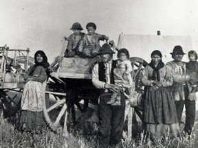 Métis Family and a Red River Cart, 1883.