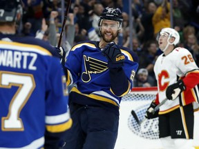 Alex Pietrangelo, centre, is congratulated by Jaden Schwartz after scoring a goal during the second period of their game Wednesday in St. Louis.