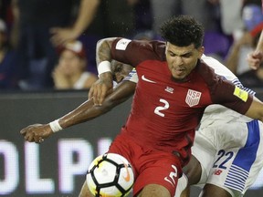 United States' DeAndre Yedlin (2) blocks the path of Panama's Abdiel Arroyo (22) path for a shot during the second half of a World Cup qualifying soccer match, Friday, Oct. 6, 2017, in Orlando, Fla. The United States won 4-0. (AP Photo/John Raoux)
