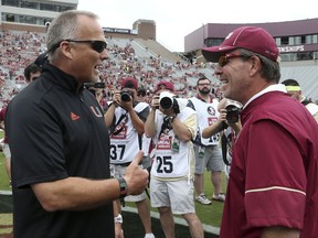 Miami's head coach Mark Richt, left, talks to Florida State's head coach Jimbo Fisher before the start of an NCAA college football game, Saturday, Oct. 7, 2017, in Tallahassee, Fla. (AP Photo/Steve Cannon)