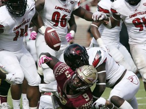 Florida State's Jacques Patrick fumbles the ball into the end zone where it was recovered by Florida State for a touchdown in the fourth quarter of an NCAA college football game with Louisville, Saturday, Oct. 21, 2017, in Tallahassee Fla. Louisville won 31-28. (AP Photo/Steve Cannon)
