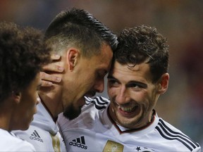 Germany's Sandro Wagner, left, and his teammate Leon Goretzka celebrate after Wagner scored his side's second goal during the 2018 World Cup qualifying Group C soccer match between Germany and Azerbaijan in Kaiserslautern, Germany, Sunday, Oct. 8, 2017.(AP Photo/Michael Probst)