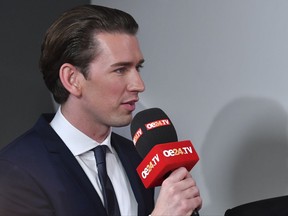 Foreign Minister Sebastian Kurz, head of Austrian People's Party, speaks during an interview in Vienna, Austria, Sunday, Oct. 15, 2017, after the closing of the polling stations for the Austrian national elections. (AP Photo/Kerstin Joensson)