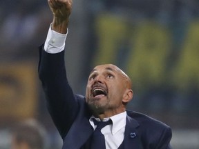 Inter Milan coach Luciano Spalletti points up during the Serie A soccer match between Inter Milan and AC Milan, at the Milan San Siro Stadium, Italy, Sunday, Oct. 15, 2017. (AP Photo/Antonio Calanni)