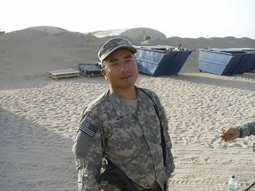 FILE - In this undated file photograph courtesy of Chong Kim provided by his attorney Tim Warden-Hertz, Chong Kim poses for a photo in National Guard fatigues. An immigrant rights group is asking the U.S. Department of Homeland Security to release an Iraq War veteran who has been detained for more than three months while waiting to learn whether he'll be deported. Chong Kim, a South Korean immigrant and green card holder from Portland, Oregon, joined the National Guard in 2005 and served in Iraq in 2009 and 2010. Kim has a parole hearing Wednesday, Oct. 4, 2017. (Chong Kim via AP, File)