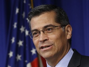 FILE - In this May 3, 2017, file photo, California Attorney General Xavier Becerra answers a question during a news conference in Sacramento, Calif. The top lawyers for 19 states will urge a federal judge Monday, Oct. 23, 2017, to force President Donald Trump's administration to pay health care subsidies he abruptly cut off earlier this month. State attorneys general, led by Becerra, argue the monthly payments are required under former President Barack Obama's health care law, and cutting them off will harm consumers. (AP Photo/Rich Pedroncelli, File)