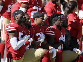 San Francisco 49ers players kneel during the performance of the national anthem before an NFL football game between the 49ers and the Dallas Cowboys in Santa Clara, Calif., Sunday, Oct. 22, 2017. (AP Photo/Eric Risberg)