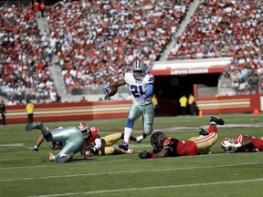 Dallas Cowboys running back Ezekiel Elliott (21) runs against the San Francisco 49ers during the first half of an NFL football game in Santa Clara, Calif., Sunday, Oct. 22, 2017. (AP Photo/Marcio Jose Sanchez)