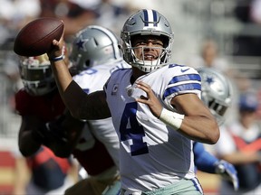 Dallas Cowboys quarterback Dak Prescott (4) passes against the San Francisco 49ers during the first half of an NFL football game in Santa Clara, Calif., Sunday, Oct. 22, 2017. (AP Photo/Marcio Jose Sanchez)