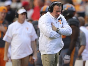 Tennessee head coach Butch Jones walks the sidelines in the final minutes of a 41-0 loss to Georgia in an NCAA college football game against Tennessee on Saturday, Sept. 30, 2017, in Knoxville, Tenn. (Curtis Compton/Atlanta Journal-Constitution via AP)