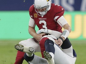 Arizona Cardinals quarterback Carson Palmer (3) is sacked during the first half of an NFL football game against Los Angeles Rams at Twickenham Stadium in London, Sunday Oct. 22, 2017. (AP Photo/Tim Ireland)