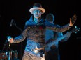 In this Oct. 21, 2016 file photo, Gord Downie performs songs from his solo album, Secret Path, at Roy Thomson Hall in Toronto.