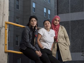 Activists, students, and artists, from left to right, Rebecca Thomas, Kati George-Jim, and Masuma Khan pose in Halifax on Oct. 28.