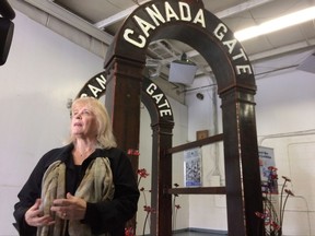 Nova Scotia artist Nancy Keating stands before a new monument called "Canada Gate," which will soon be shipping to Belgium, where it will pay tribute to Canadian soldiers who fought in the Battle of Passchendaele a century ago. A ceremonial send-off was held Monday, Oct.2, 2017 at a warehouse in Halifax. The twin arches will be installed near Passchendaele in the days leading up to centennial events next month marking the end of the 100-day battle -- the bloodiest fight in Canadian military history. THE CANADIAN PRESS/Michael MacDonald