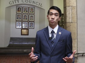 In this Wednesday, Oct. 25, 2017, photo, Honolulu Councilman Brandon Elefante speaks to The Associated Press in Honolulu. A new Honolulu ordinance, authored by Elefante, allows police officers to issue tickets to pedestrians caught looking at a cellphone or electronic device while crossing a city street. (AP Photo/Caleb Jones)