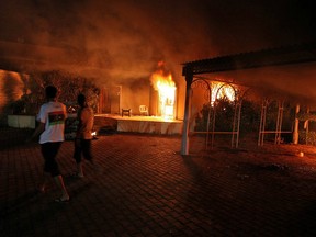 Buildings burn after they were set on fire inside the U.S. consulate compound in Benghazi late on September 11, 2012