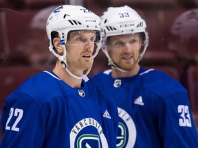 Vancouver Canucks forward Daniel (left) and Henrik Sedin.