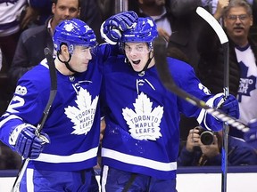 Toronto Maple Leafs forwards Patrick Marleau (left) and Auston Matthews celebrate a goal against the Carolina Hurricanes on Oct. 26.