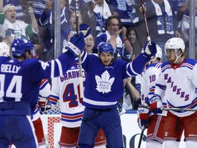 Maple Leafs centre Zach Hyman celebrates a goal in front of New York Rangers goalie Henrik Lundqvist during first period NHL action in Toronto on Saturday night.