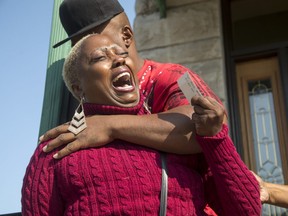 Teresa Jenkins is comforted by her boyfriend on the porch of her apartment as she talks about her daughter, Kenneka Jenkins, in Chicago.