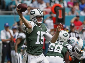 New York Jets quarterback Josh McCown (15) looks to pass during the first half of an NFL football game against the Miami Dolphins, Sunday, Oct. 22, 2017, in Miami Gardens, Fla. (AP Photo/Wilfredo Lee)
