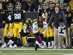 Iowa's Josh Jackson (15) breaks up a pass intended for Minnesota's Tyler Johnson during an NCAA college football game Saturday, Oct. 28, 2017, in Iowa City. (Brian Powers/The Des Moines Register via AP)