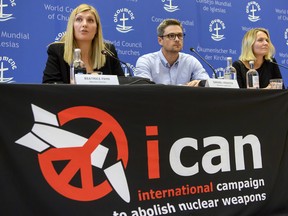 Beatrice Fihn, left, Executive Director of ICAN, Daniel Hogsta, centre, coordinator and Grethe Ostern, right, member of the steering committee, speak during a press conference, at ICAN headquarters in Geneva, Switzerland, on Friday, Oct. 6, 2017. ICAN is the winner of this year's Nobel Peace Prize.