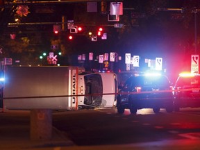 An overturned U-Haul truck is seen on 100 Avenue near 106 Street after Edmonton Police Service officers arrested a man who attacked a police officer outside of an Edmonton Eskimos game at 92 Street and 107A Avenue in Edmonton, Alberta on Sunday, October 1, 2017.
