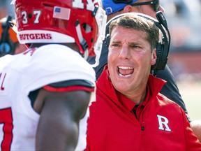 Rutgers head coach Chris Ash talks to defensive back Zane Campbell (37) during the fourth quarter of an NCAA college football game against Illinois, Saturday, Oct. 14, 2017, at Memorial Stadium in Champaign, Ill. (AP Photo/Bradley Leeb)