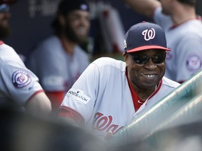 Washington Nationals manager Dusty Baker smiles from the dugout before Game 3 of the National League Division Series baseball game against the Chicago Cubs Monday, Oct. 9, 2017, in Chicago. (AP Photo/Nam Y. Huh)