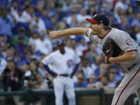 Washington Nationals starting pitcher Max Scherzer throws during the first inning of Game 3 of the National League Division Series baseball game against the Chicago Cubs Monday, Oct. 9, 2017, in Chicago. (AP Photo/Nam Y. Huh)
