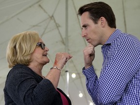 FILE - In this Aug. 17, 2017, file photo, Democratic Sen. Claire McCaskill, left, talks with Republican Missouri Attorney General Josh Hawley during the Governor's Ham Breakfast at the Missouri State Fair in Sedalia, Mo. Hawley announced in a video to be released Tuesday that he will run for the U.S. Senate in 2018 against the incumbent McCaskill. Hawley was elected attorney general in 2016, his first-ever elected office. (AP Photo/Charlie Riedel, File)