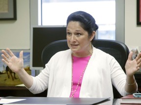 FILE - In this June 14, 2017, file photo, Illinois Comptroller Susana Mendoza, speaks during an interview in Chicago. A review of Illinois' $16 billion pile of overdue bills by Mendoza shows that likely half haven't been submitted for processing, and there's no way of knowing whether there's even authority to pay. (AP Photo/G-Jun Yam File)