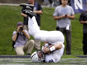 Penn State quarterback Tommy Stevens catches a touchdown pass during the first half of an NCAA college football game against Northwestern in Evanston, Ill., Saturday, Oct. 7, 2017. (AP Photo/Nam Y. Huh)