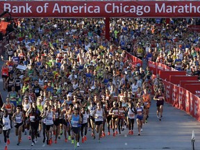 Runners start the Chicago Marathon, Sunday, Oct. 8, 2017, in Chicago. (AP Photo/Nam Y. Huh)