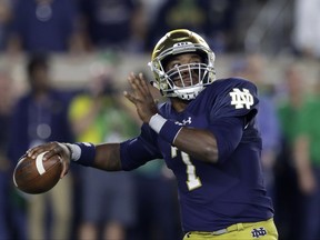 Notre Dame quarterback Brandon Wimbush throws during the first half of an NCAA college football game against Southern California, Saturday, Oct. 21, 2017, in South Bend, Ind. (AP Photo/Carlos Osorio)