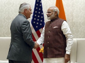 Secretary of State Rex Tillerson shakes hands with Indian Prime Minister Narendra Modi before their meeting at the Prime Minister's residence, Wednesday, Oct. 25, 2017, in New Delhi, India. (AP Photo/Alex Brandon, Pool)