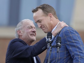 Indianapolis Colts owner Jim Irsay hugs former Indianapolis Colts quarterback Peyton Manning during the unveiling of a Peyton Manning statue outside of Lucas Oil Stadium, Saturday, Oct. 7, 2017, in Indianapolis. (AP Photo/Darron Cummings)