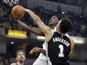 Indiana Pacers' Victor Oladipo puts up a shot shot against San Antonio Spurs' Kyle Anderson (1) during the first half of an NBA basketball game, Sunday, Oct. 29, 2017, in Indianapolis. (AP Photo/Darron Cummings)